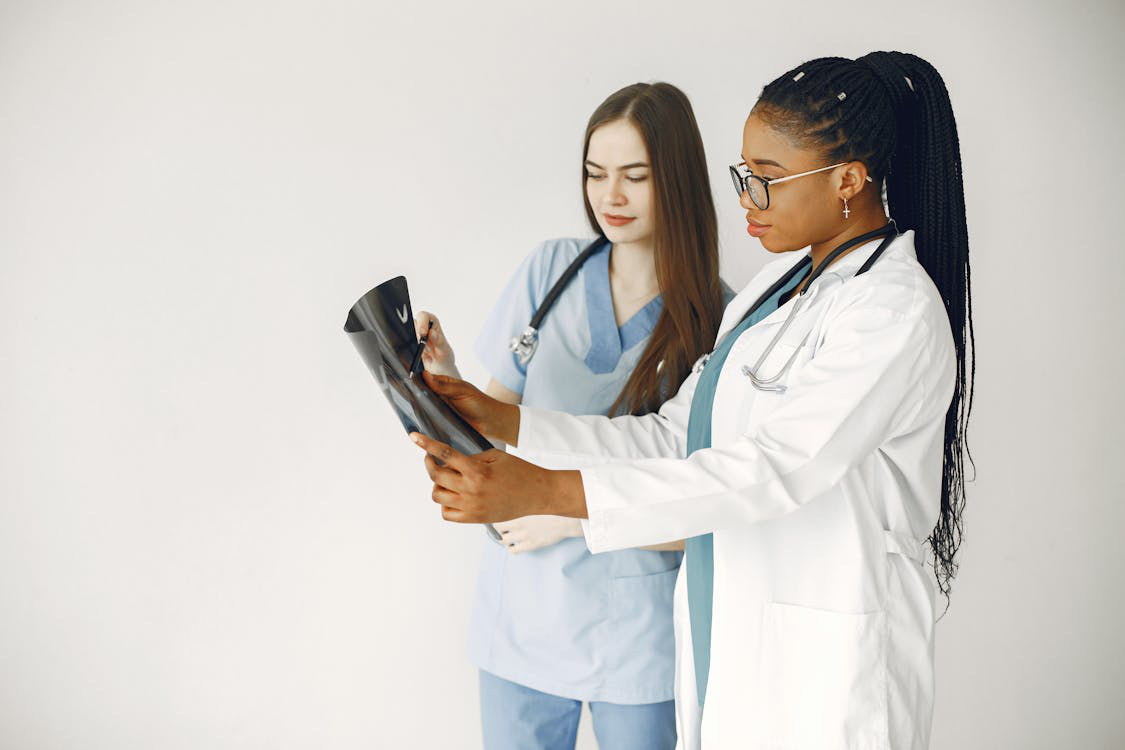 Two doctors reviewing an X-ray scan together.