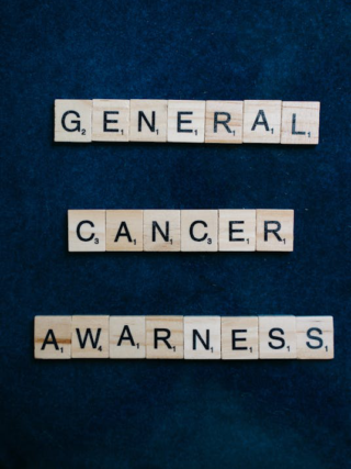 Scrabble tiles spelling "General Cancer Awareness."