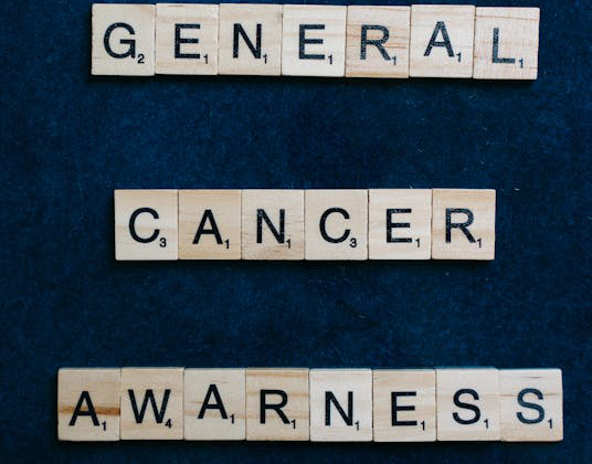 Scrabble tiles spelling "General Cancer Awareness."