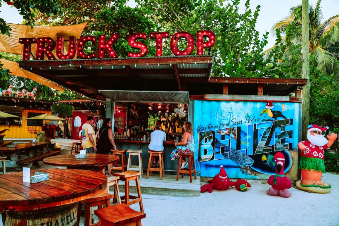 Bustling food truck stop in Belize during the evening