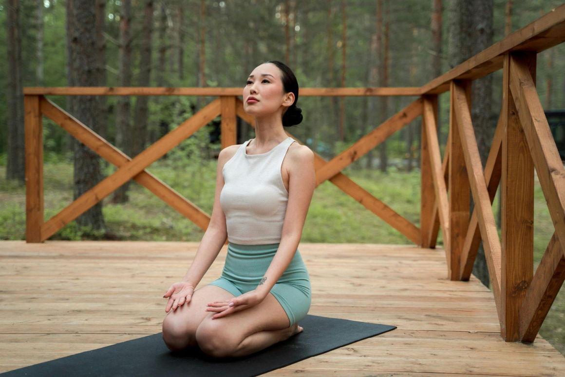 Person practicing mindful breathing outdoors.